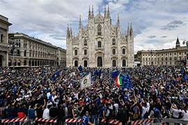Inter Milan fans waving blue and black flags